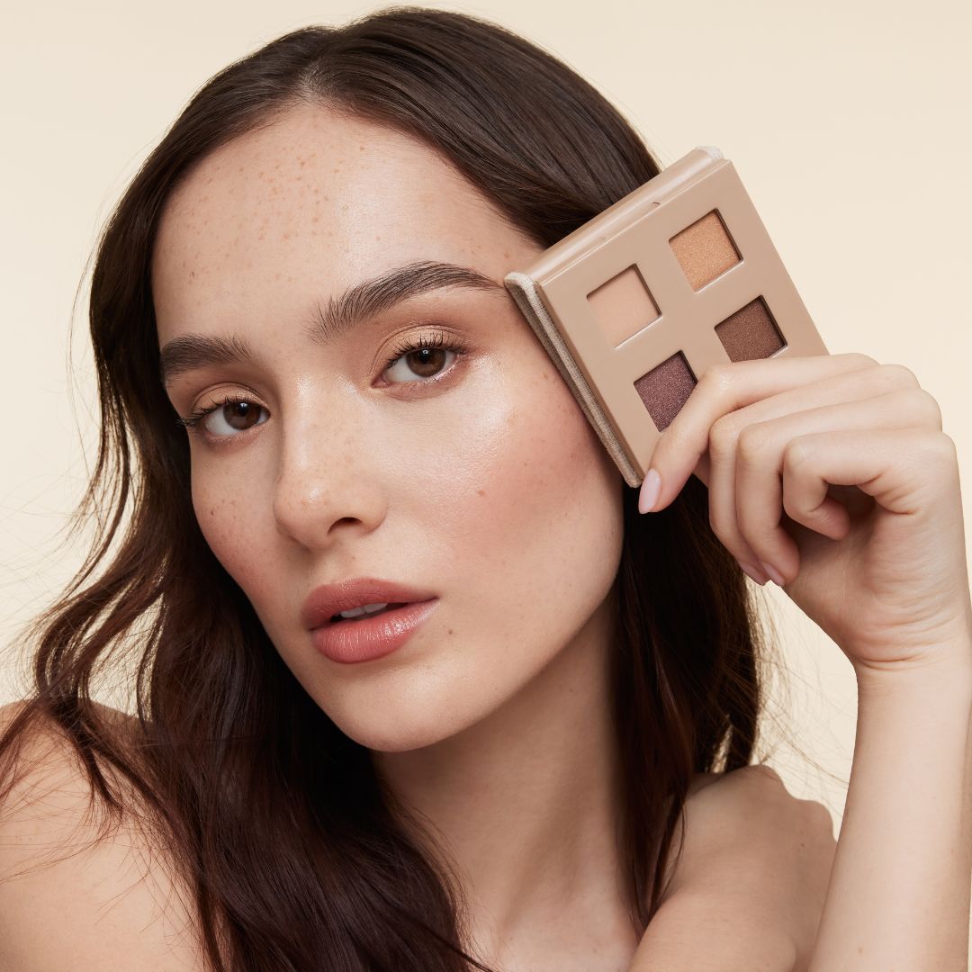 Model holding our new fold out eyes palette in a beautiful eggshell linen.