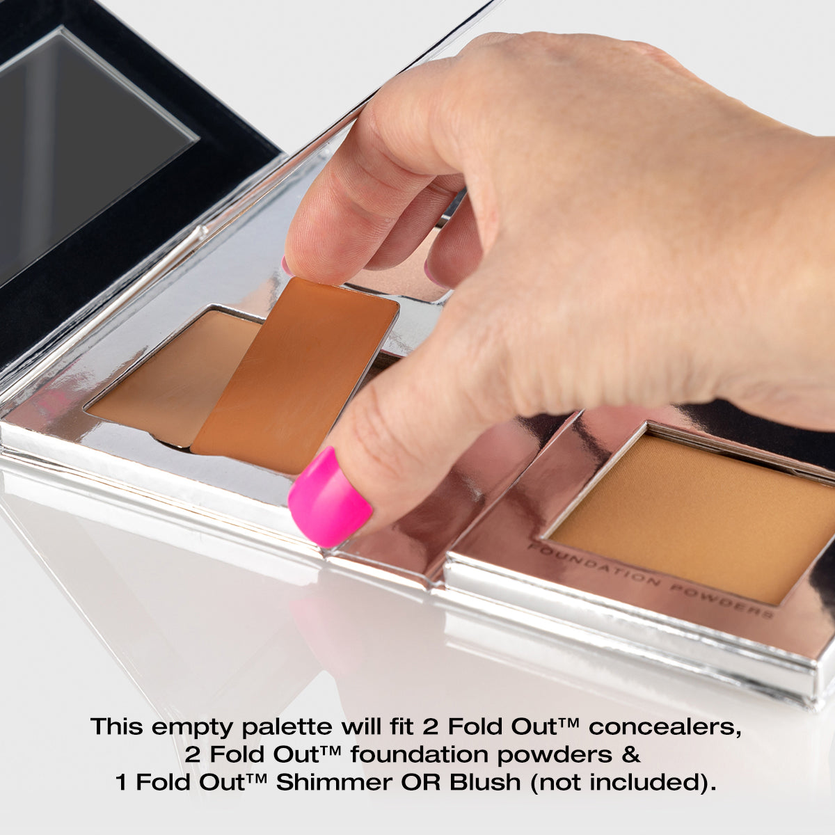 a photo of a woman's hand showing how to remove and replace one of the individual pans of makeup in the Fold Out Complexion palette