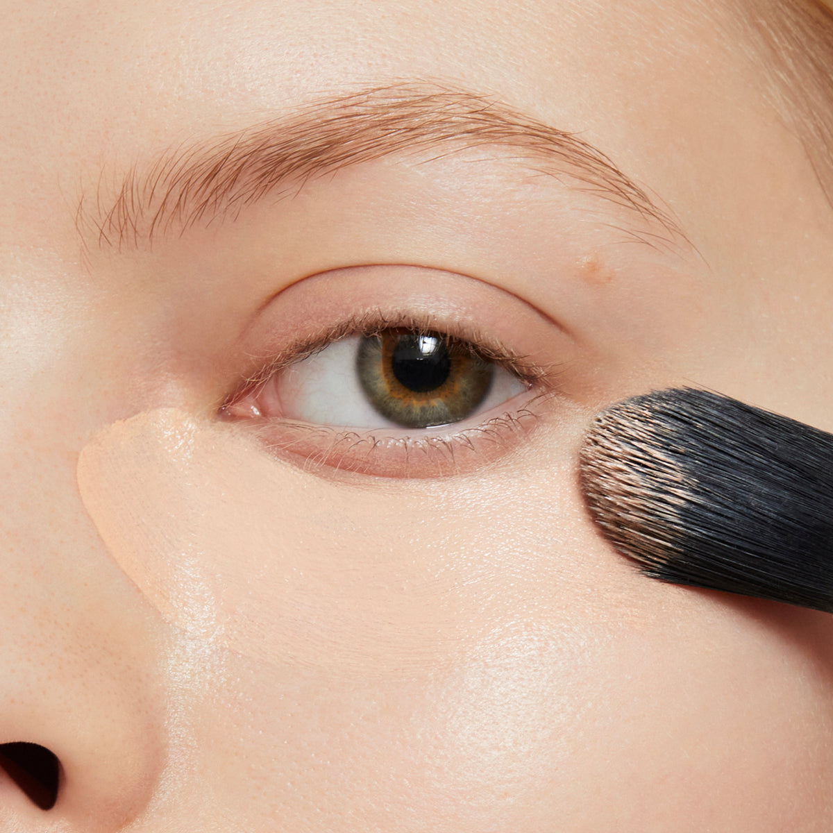 Coconut concealer coverage on model under eyes