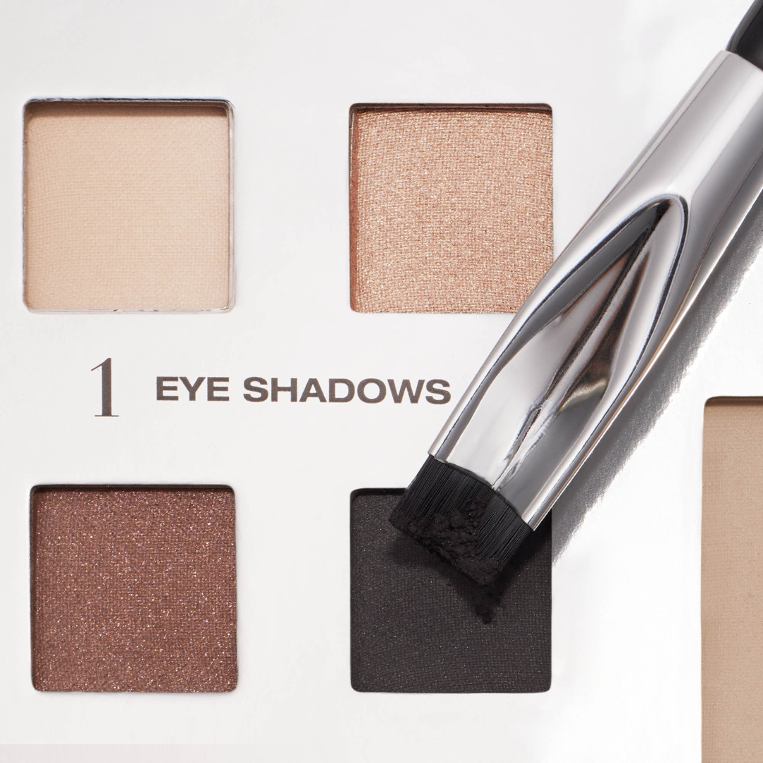 Corner brush eye stamper being dipper into licorice black eyeshadow