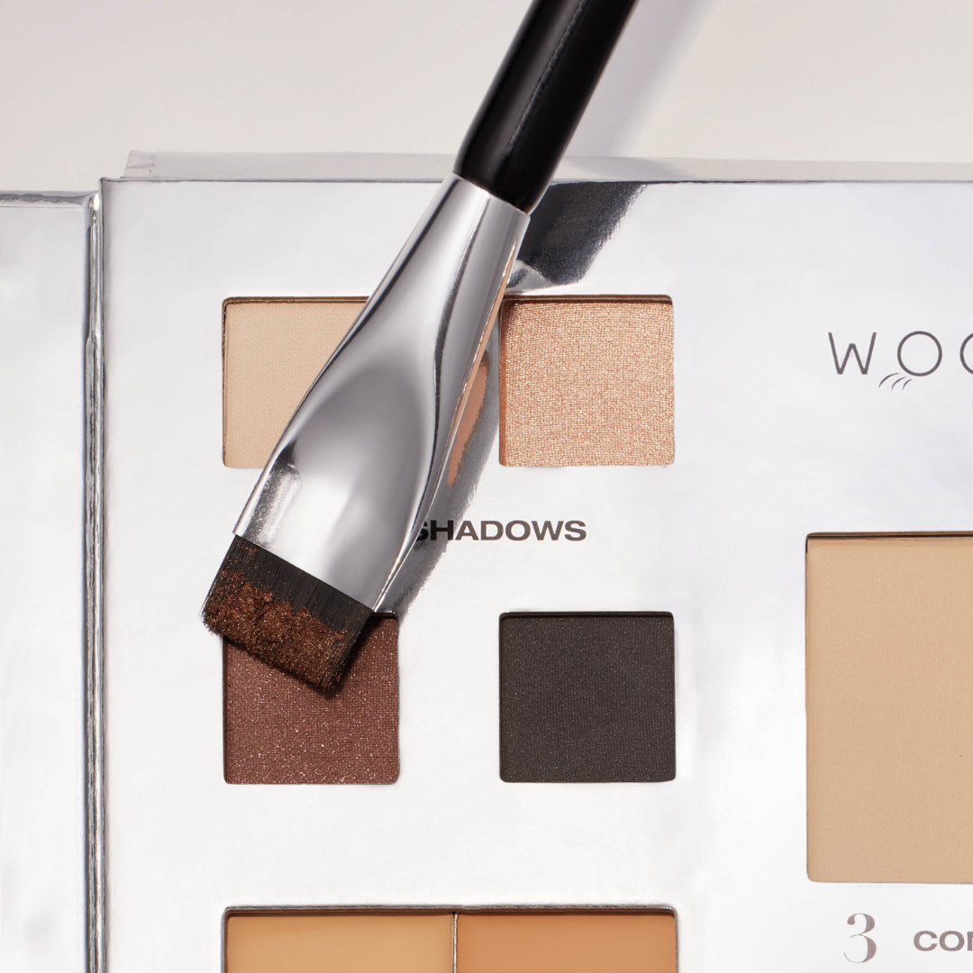 Arc brush being dipped into our truffle eye shadow