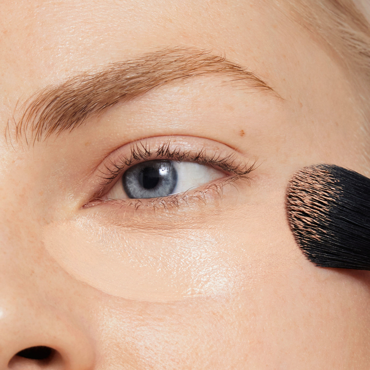 Coconut concealer coverage on model under eyes