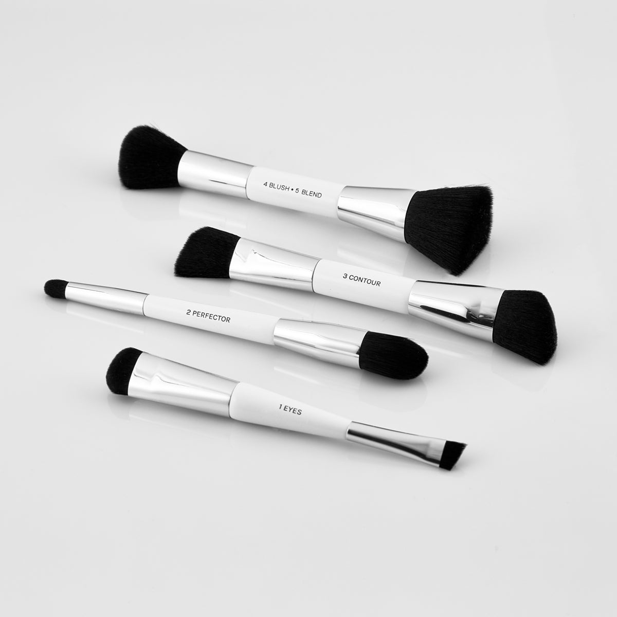 4 Dual ended Essential Brushes. 1 eyes/eyeshadow brush with angled end for eyeliner and domed end for shadow. 2 concealer brush for blemishes and larger blending end. 3 contour brush with smaller angled end for highlighting and larger angled end for contour. 4 blush and 5 blend brush for applying blushes and foundation powders.
