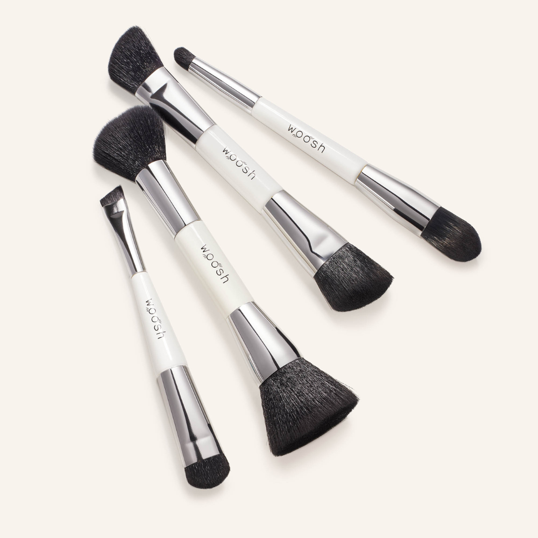 4 dual-ended essential makeup brushes in a set includes an eye brush, a concealer brush, a contour brush and a blush and blend brush, all numbered to correspond with the fold out face