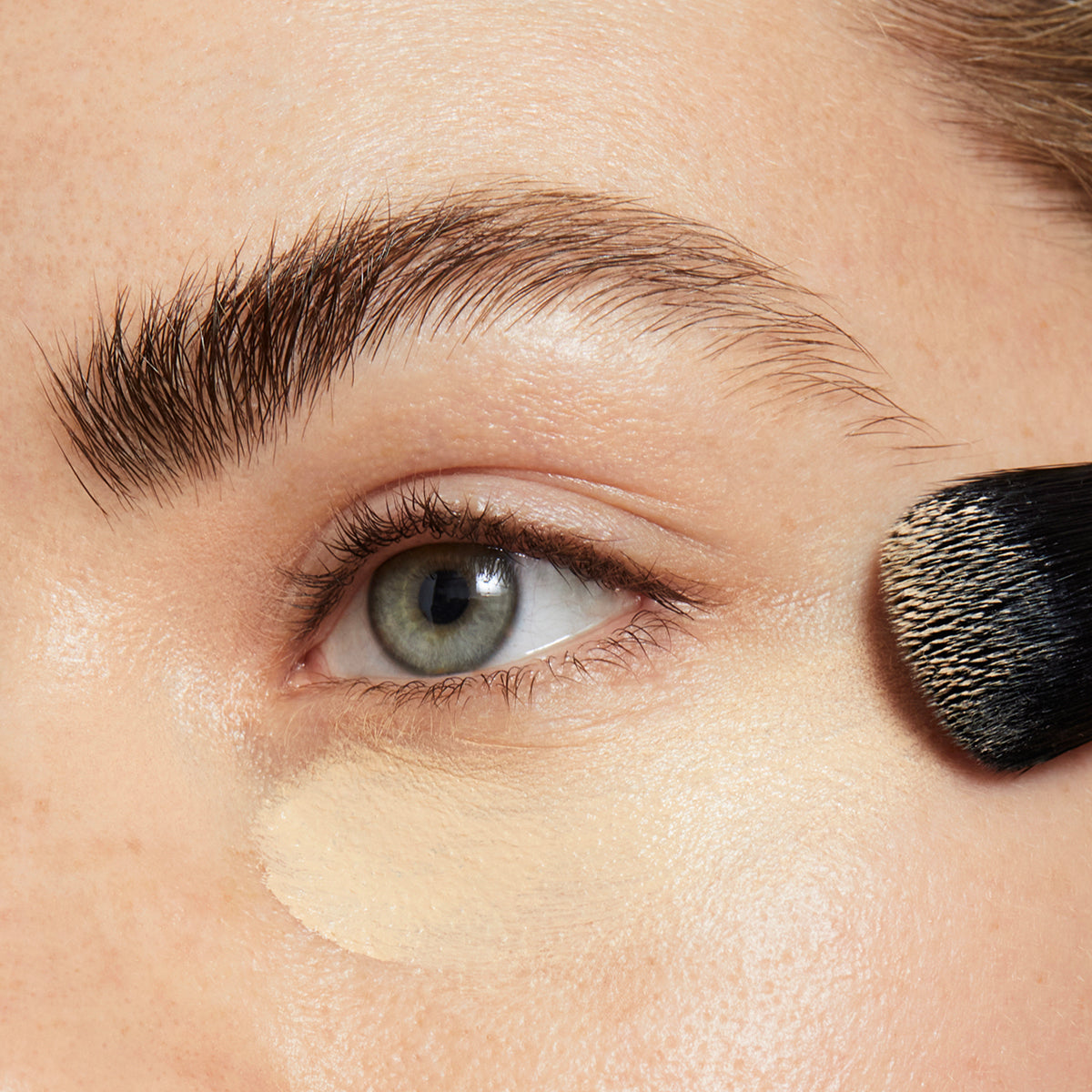 Coconut concealer coverage on model under eyes