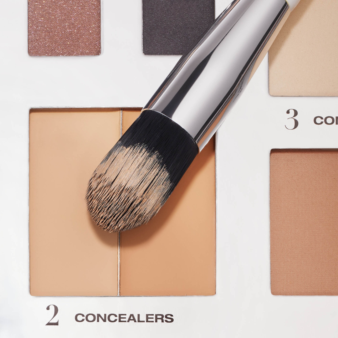 concealer brush being dipped into our cream concealers