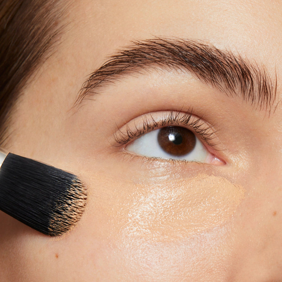 Coconut concealer coverage on model under eyes