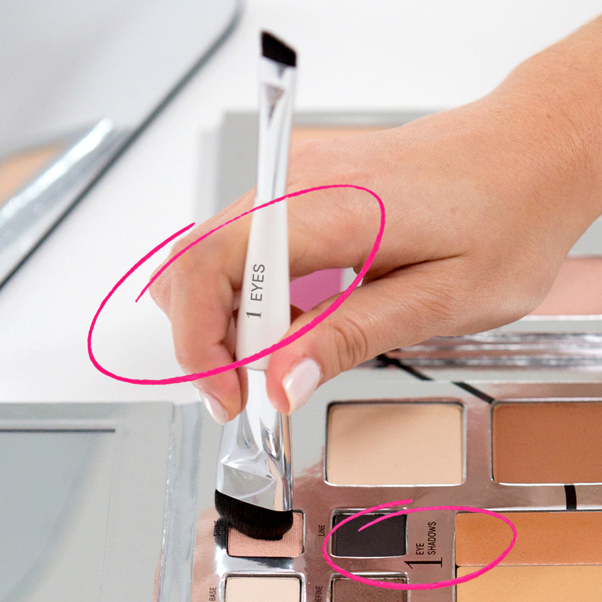 1 Eyes title on brush circled and dipped into the #1 step on eyeshadows in the fold out face palette. This dual ended brush has a dome shaped head perfect for adding shadow to lid and a angled brush end for eyeliner.