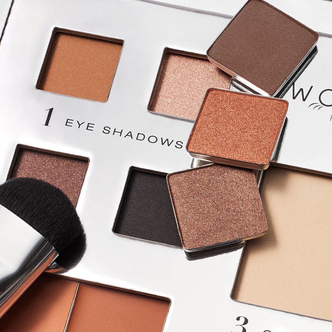 eye brush being dipped into truffle eyeshadow on our fold out face palette