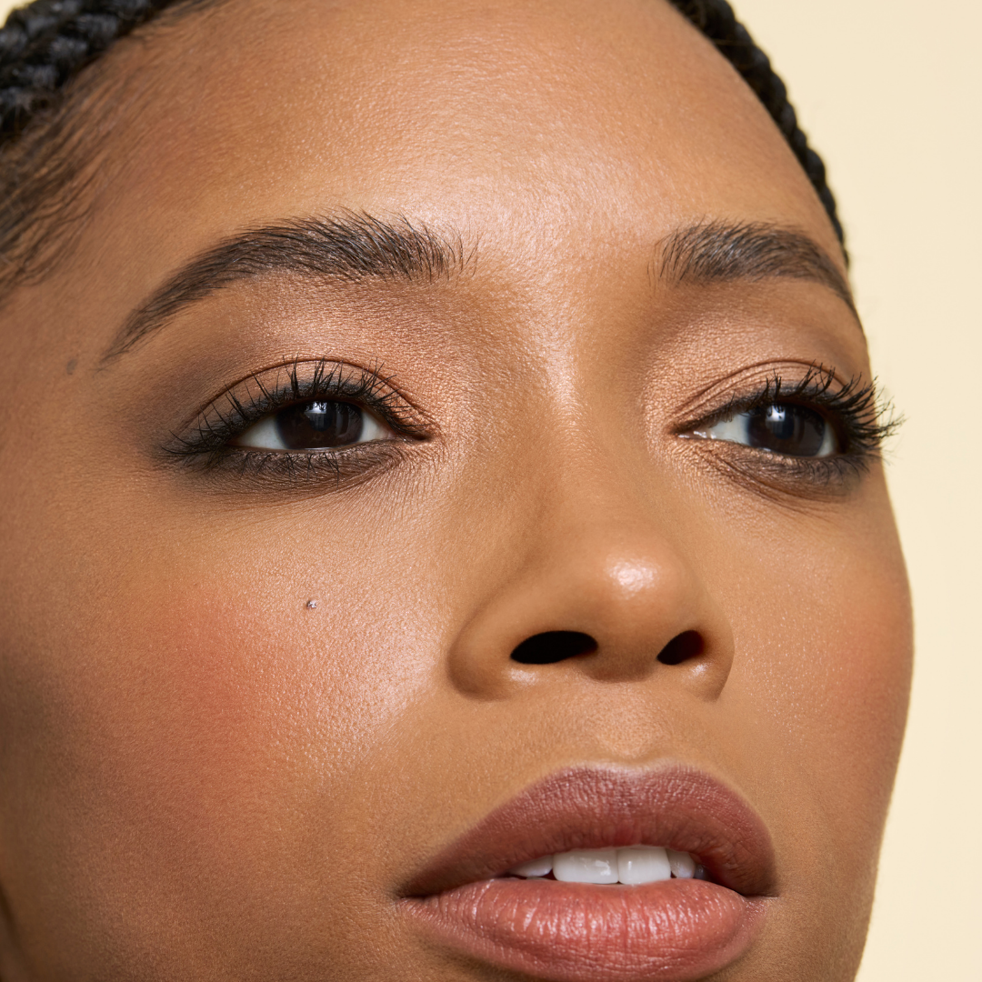 zoomed in shot of model wearing gilded earth eyeshadow quad on lid