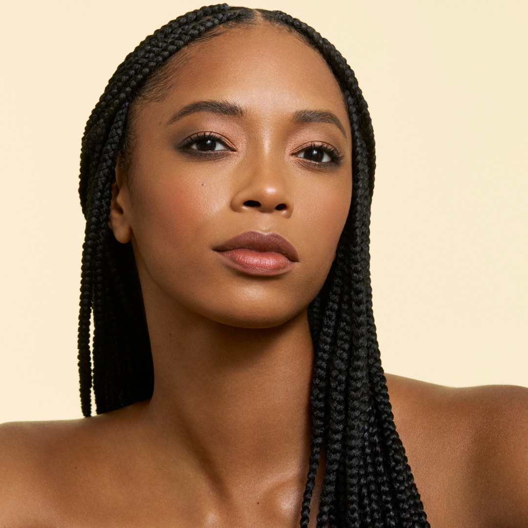 model wearing gilded earth on eyes