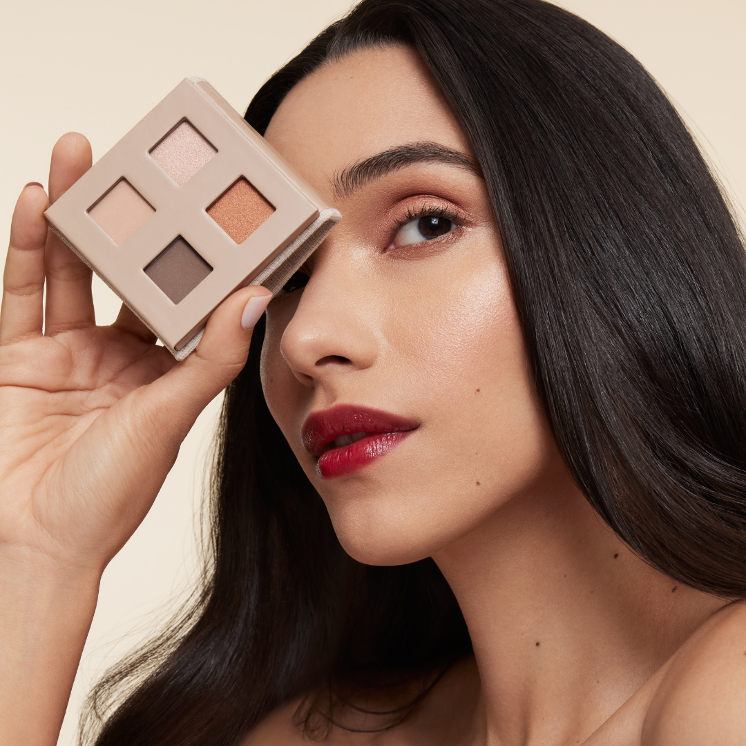 model holding fold out eyes palette with cowboy copper quad