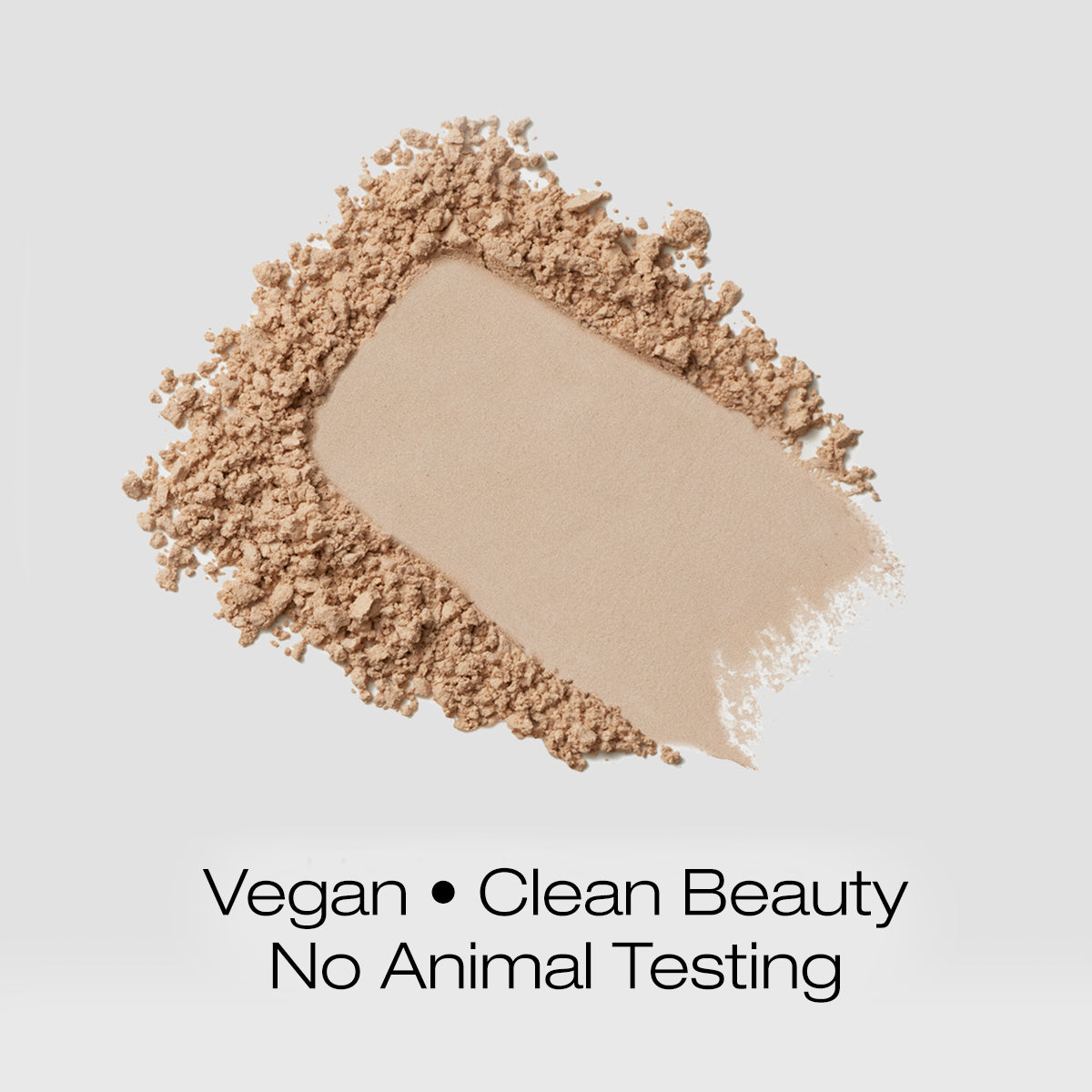 a swatch of light colored foundation powder indicating that the formula is vegan, clean beauty and is not tested on animals