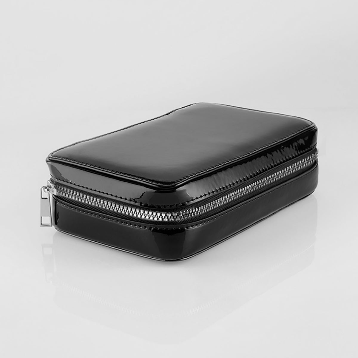 The fold out case shown closed and in black with silver zipper