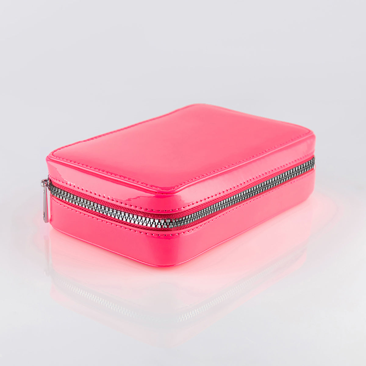 The fold out case shown closed in hot pink with silver zipper