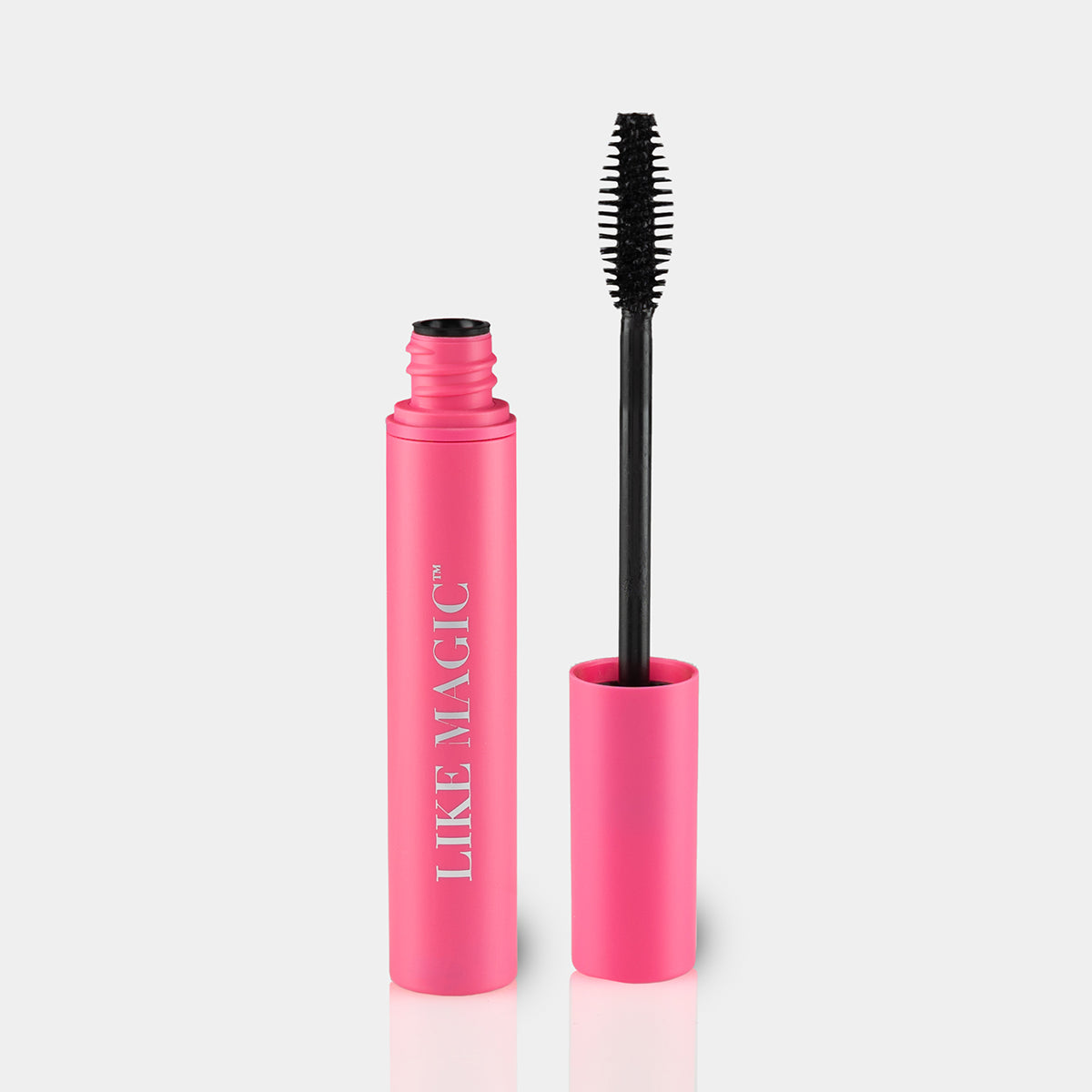Opened tube of Like Magic black mascara in pink bottle with bristles showing