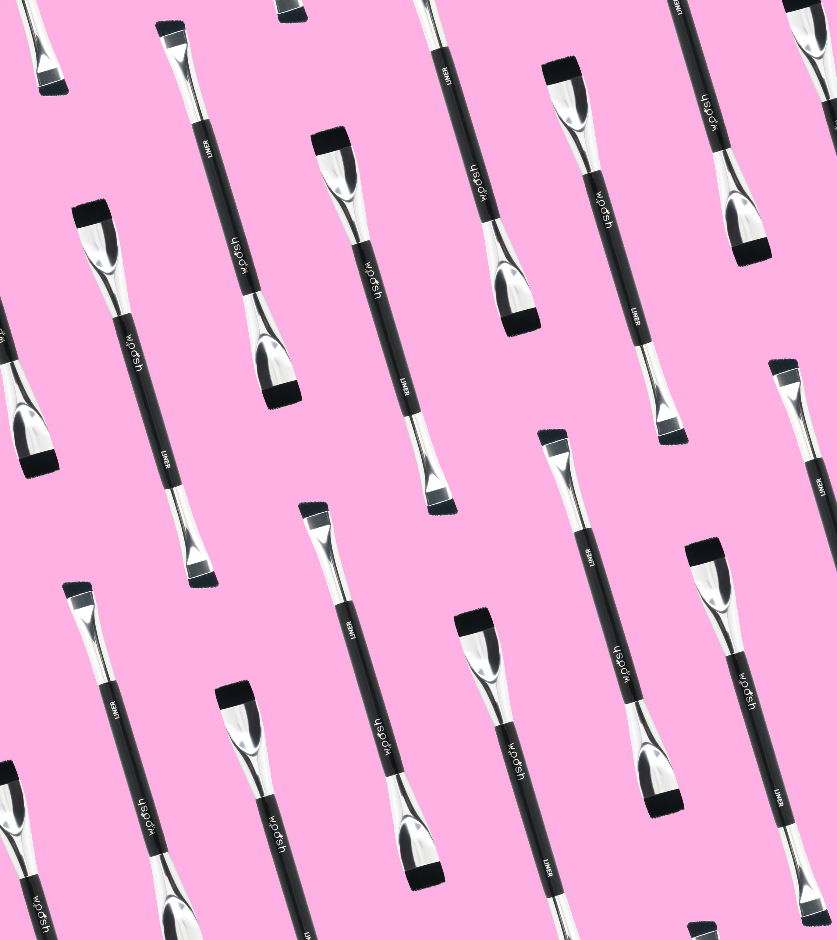 The Arc Brush displayed in an organized pattern in front of a pink background