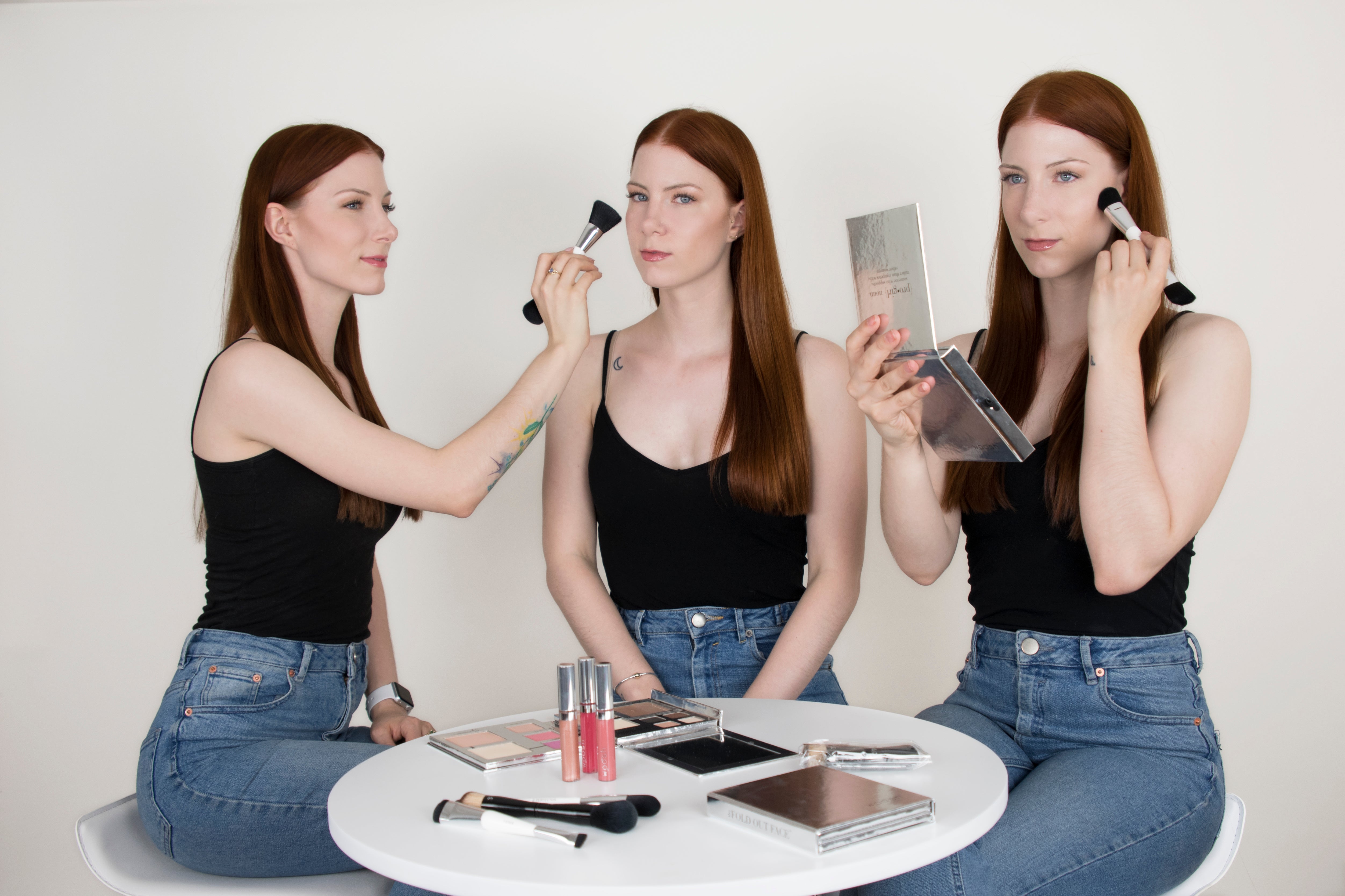 The Levesque Triplets applying makeup using the Essential makeup brush and the Fold Out Face Palette