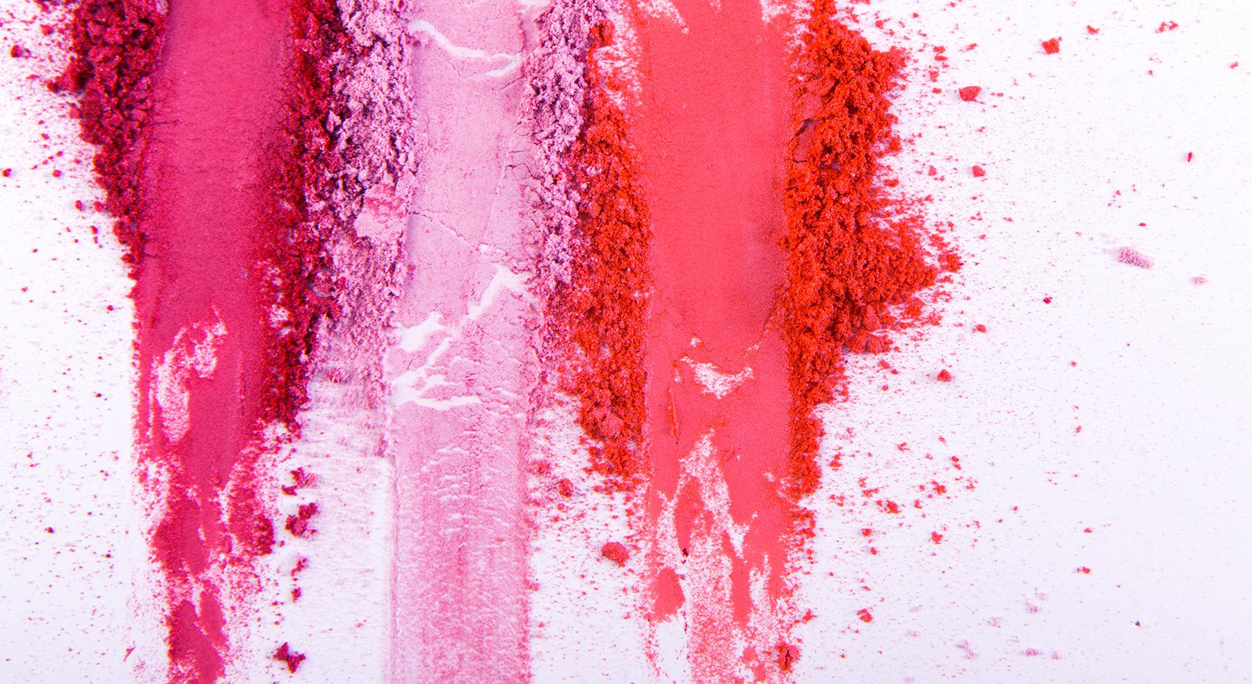 Crushed up makeup powder in different shades of pink