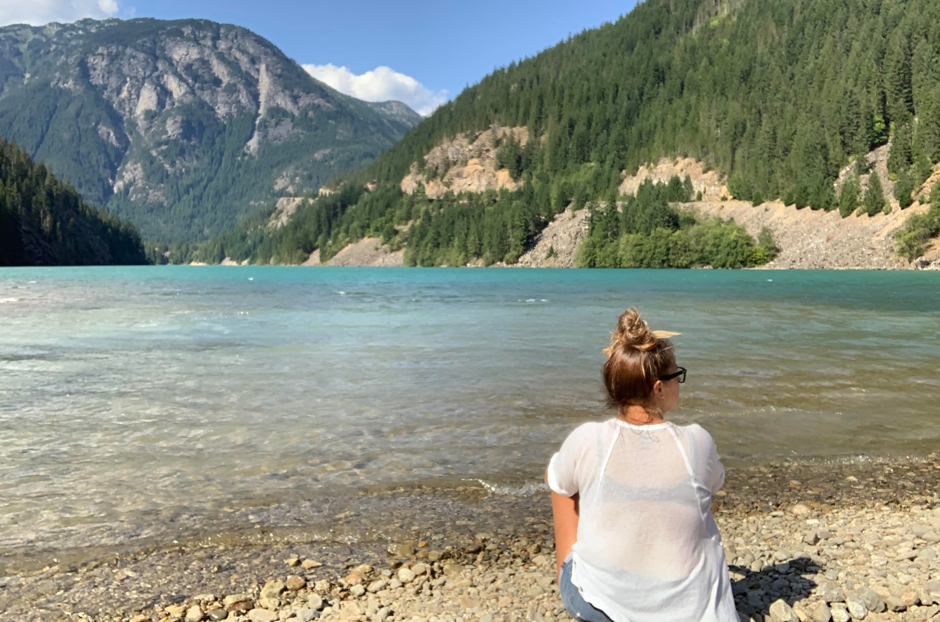 TheMotherOctopus in front of a lake and mountains