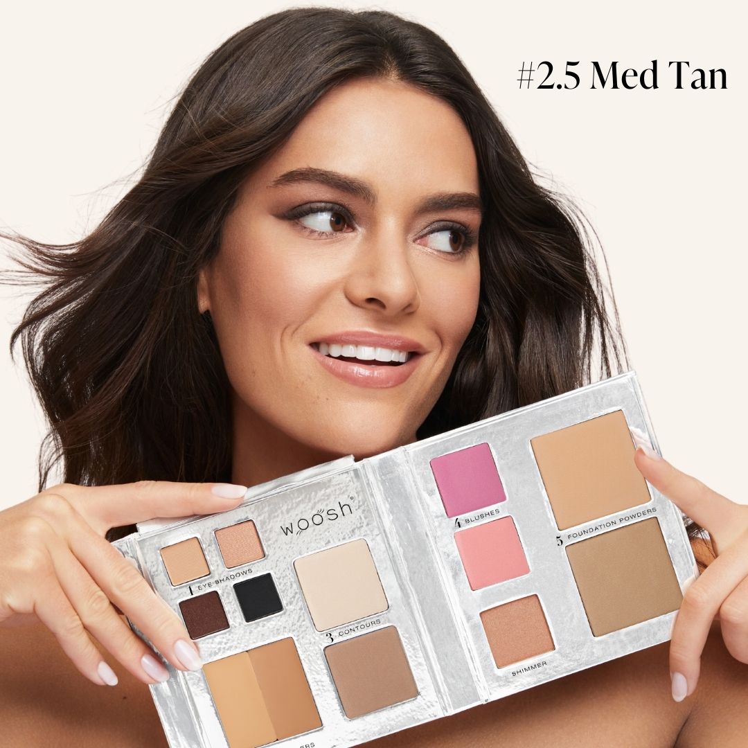 medium skinned model holding fold out face in shade #2.5 med tan