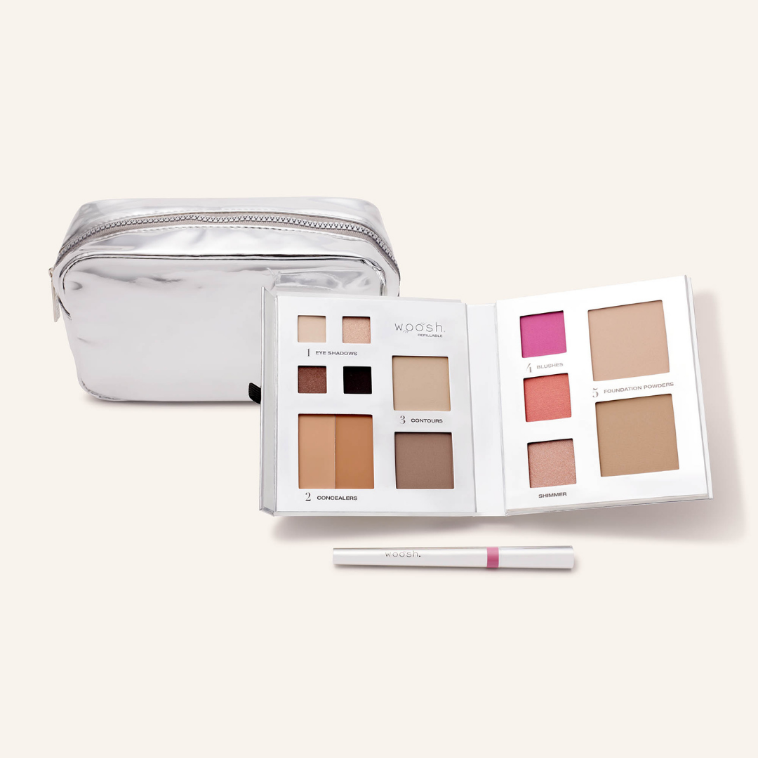 Photo of whats included in the platinum bundle. Our medium platinum silver shiny essential makeup bag, our silver 13 pan fold out face refillable palette and our lip stain in shade devoted 