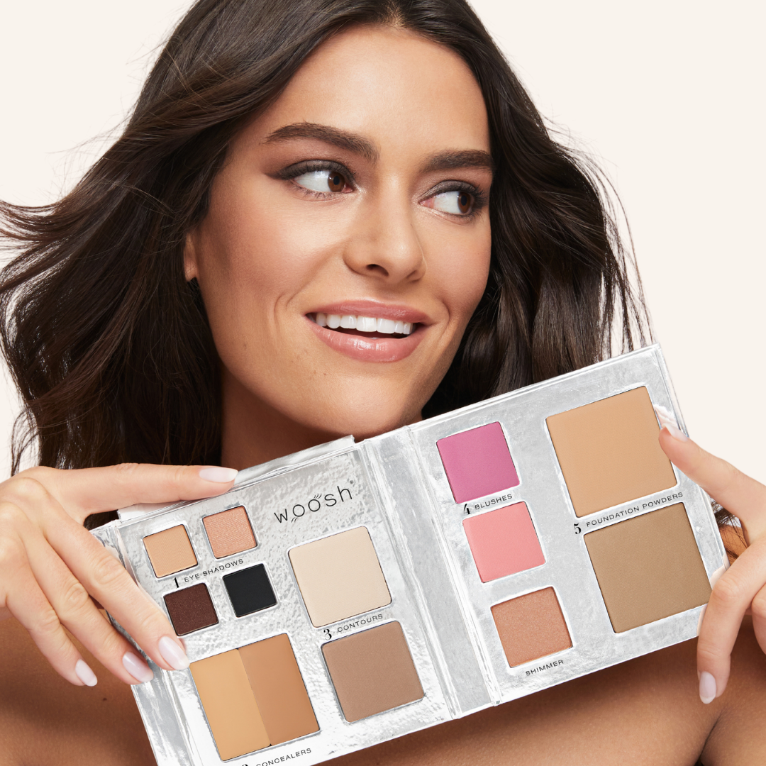 Fair skinned model with Fold out face palette open showing off the product