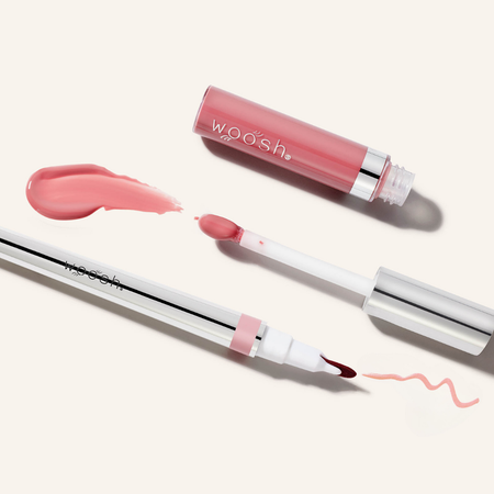 Woosh Beauty's monogamous lip stain in shade linger with spin on gloss shade hint. Image shows the components open showing the tips of each applicator and their swatches.