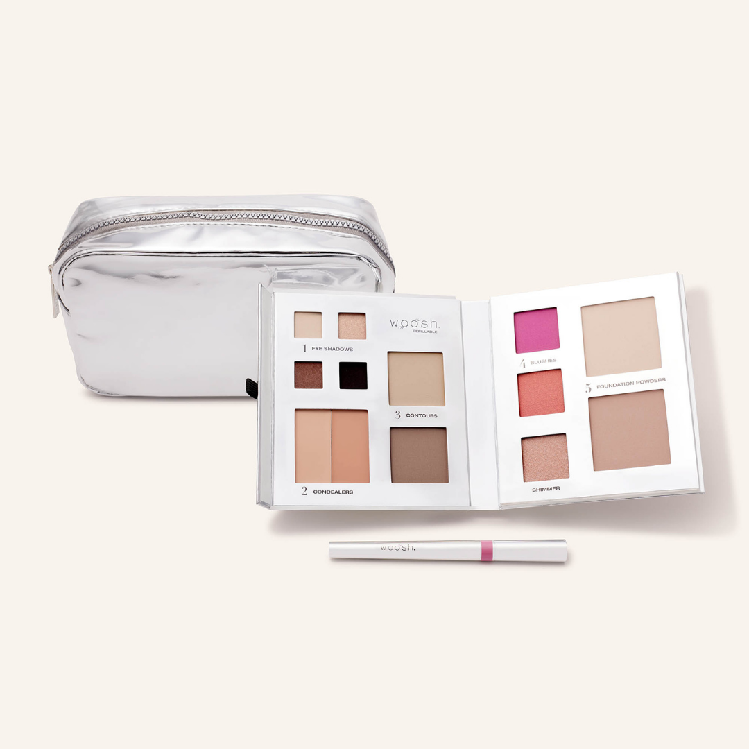 Photo of whats included in the platinum bundle. Our medium platinum silver shiny essential makeup bag, our silver 13 pan fold out face refillable palette and our lip stain in shade devoted 