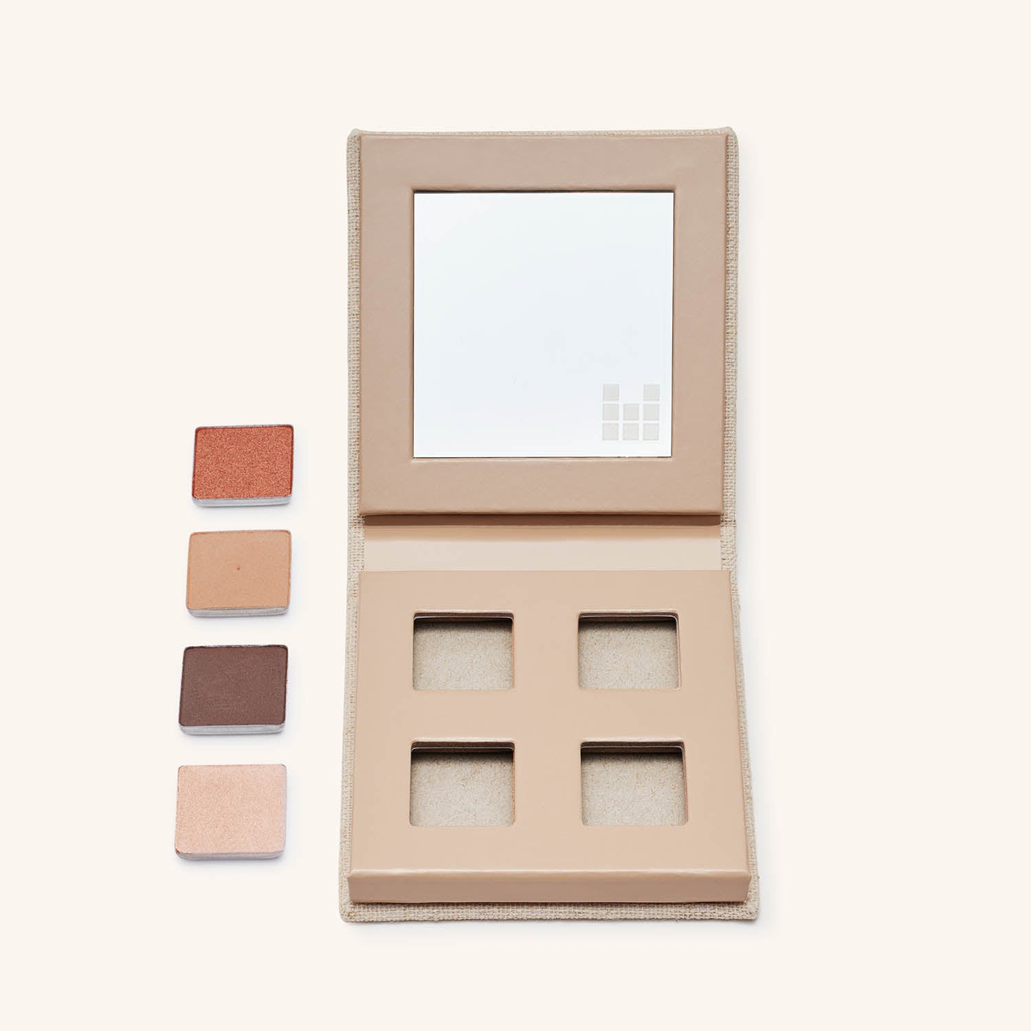 fold out eyes palette empty with eyeshadow pans next to it showing refillability