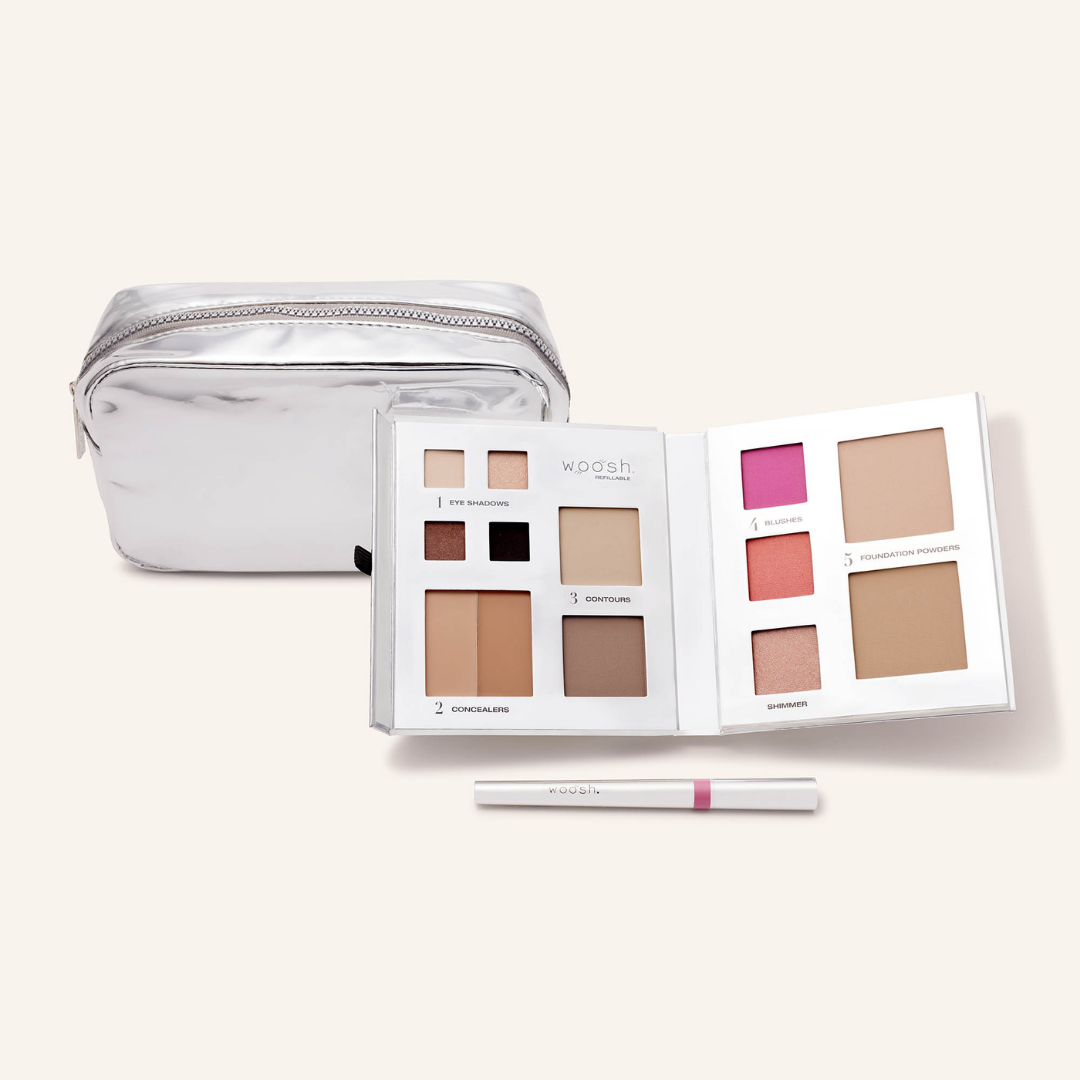 Photo of whats included in the platinum bundle. Our medium platinum silver shiny essential makeup bag, our silver 13 pan fold out face refillable palette and our lip stain in shade devoted 