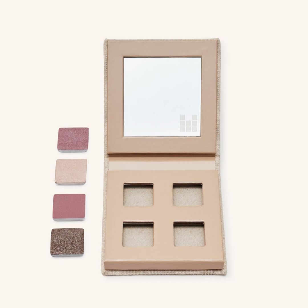 Palette with eye shadows next to it showing is refillability 