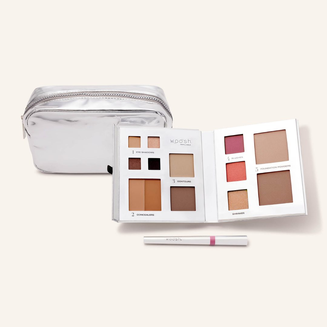 Photo of whats included in the platinum bundle. Our medium platinum silver shiny essential makeup bag, our silver 13 pan fold out face refillable palette and our lip stain in shade devoted 