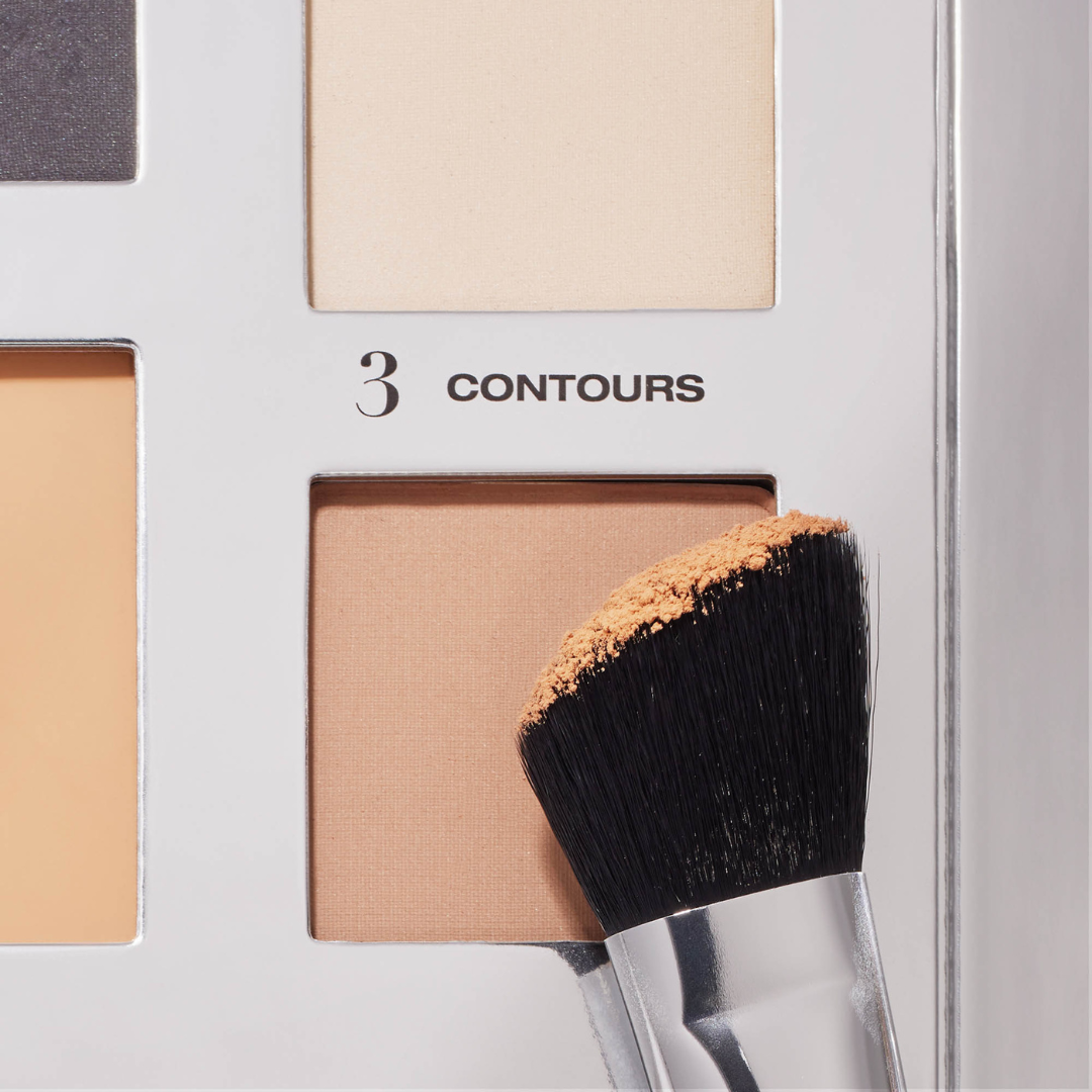 contour brush being dipped into our contour powders