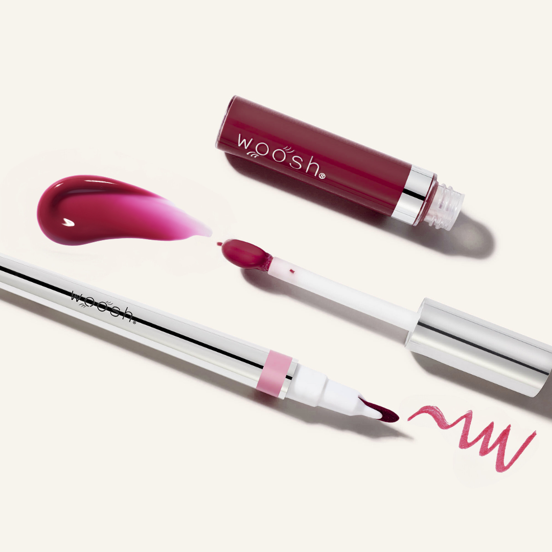 Woosh Beauty's monogamous lip stain in shade steadfast with spin on gloss shade whisper. Image shows the components open showing the tips of each applicator and their swatches.