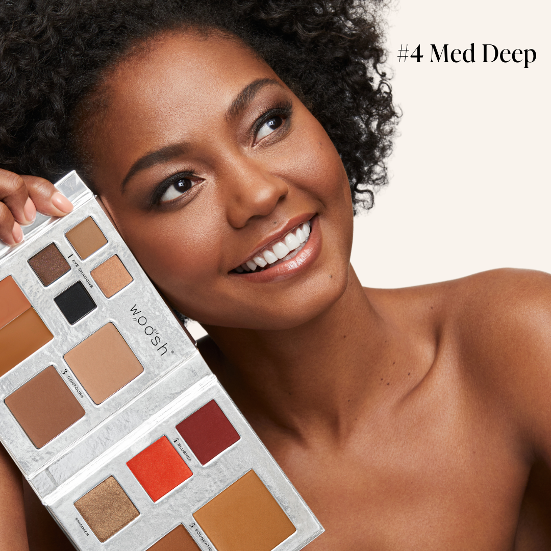 Model holding our refillable Fold out Face palette in shade #4 med deep