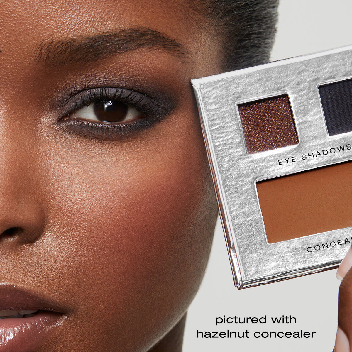 Model with Fold Out Eyes palette in shade hazelnut concealer. 