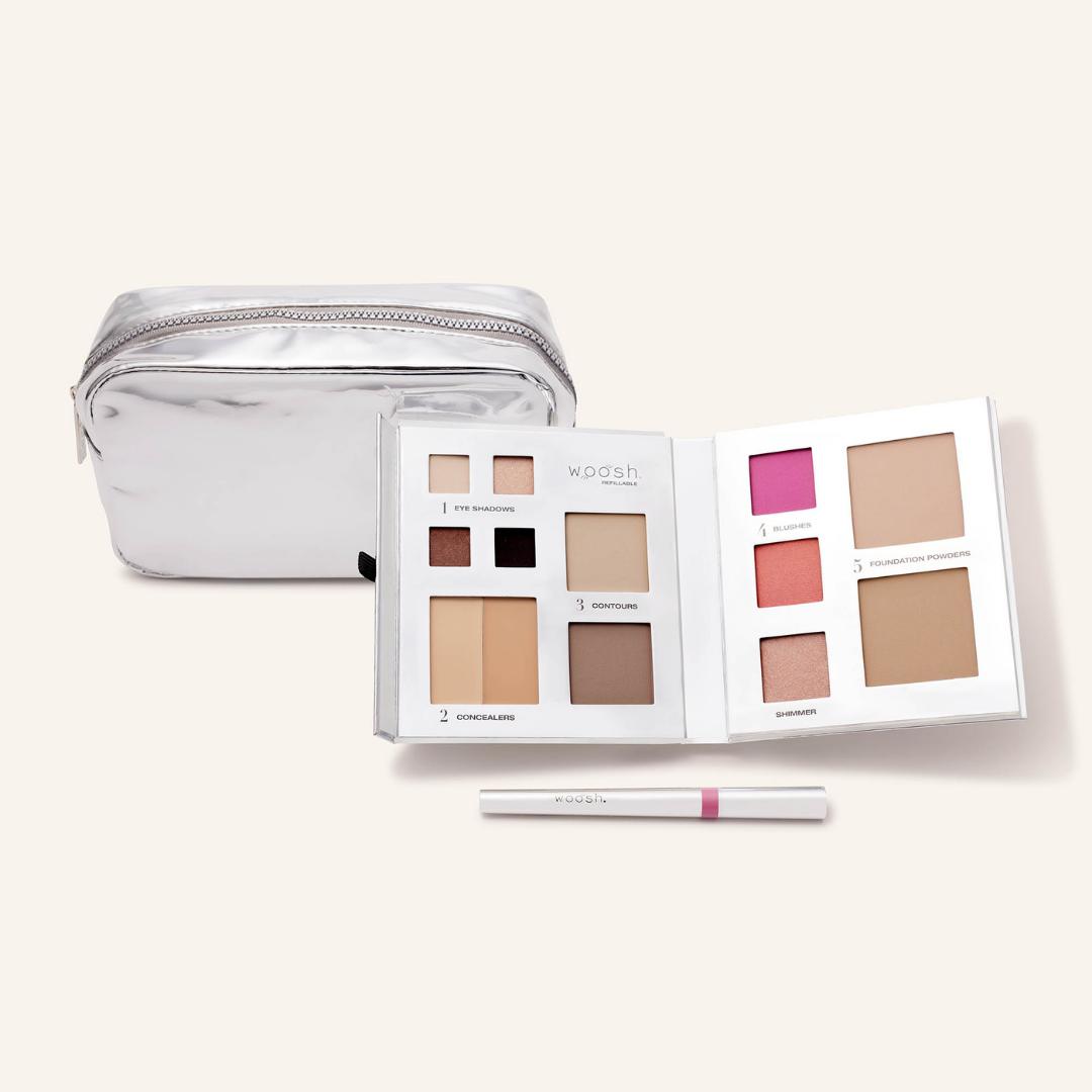 Photo of whats included in the platinum bundle. Our medium platinum silver shiny essential makeup bag, our silver 13 pan fold out face refillable palette and our lip stain in shade devoted 