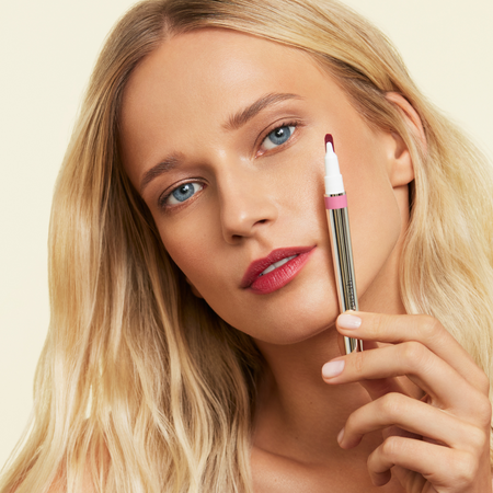 Monogamous lip stain in shade devoted applied to fair skinned models lips 