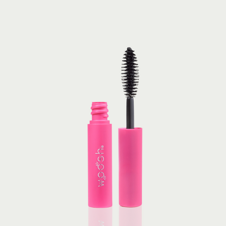 mini mascara bottle image. mascara is open showing off the unique almond shaped applicator. 