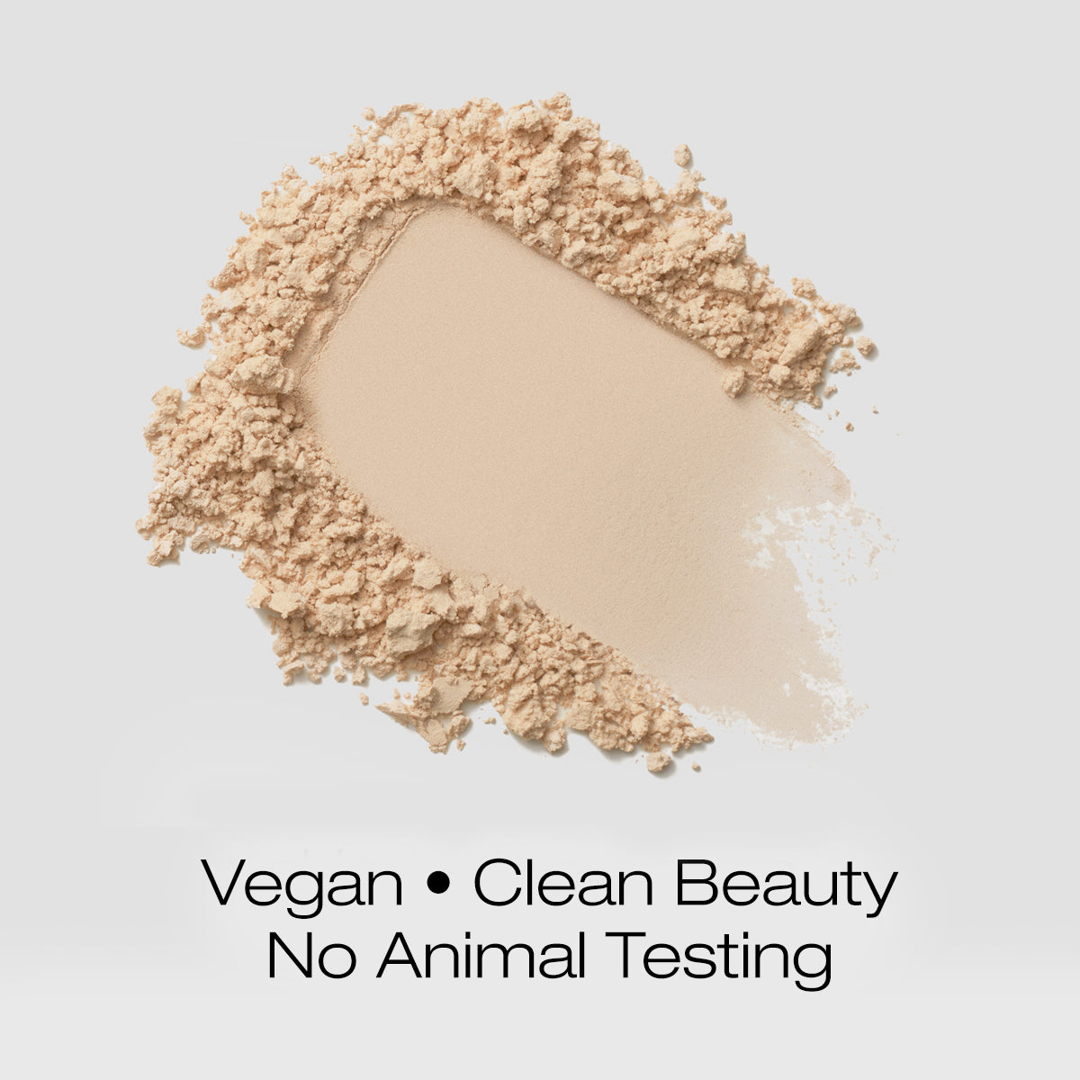 a swatch of light colored foundation powder indicating that the formula is vegan, clean beauty and is not tested on animals