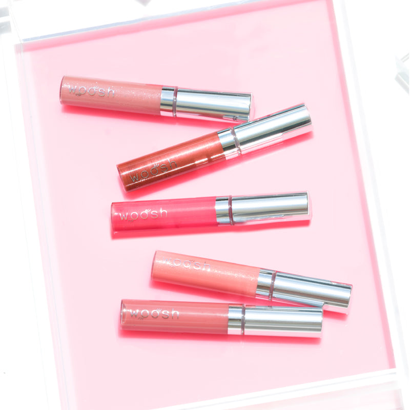 All five colors of the nude pink Spin-On Lip Glosses