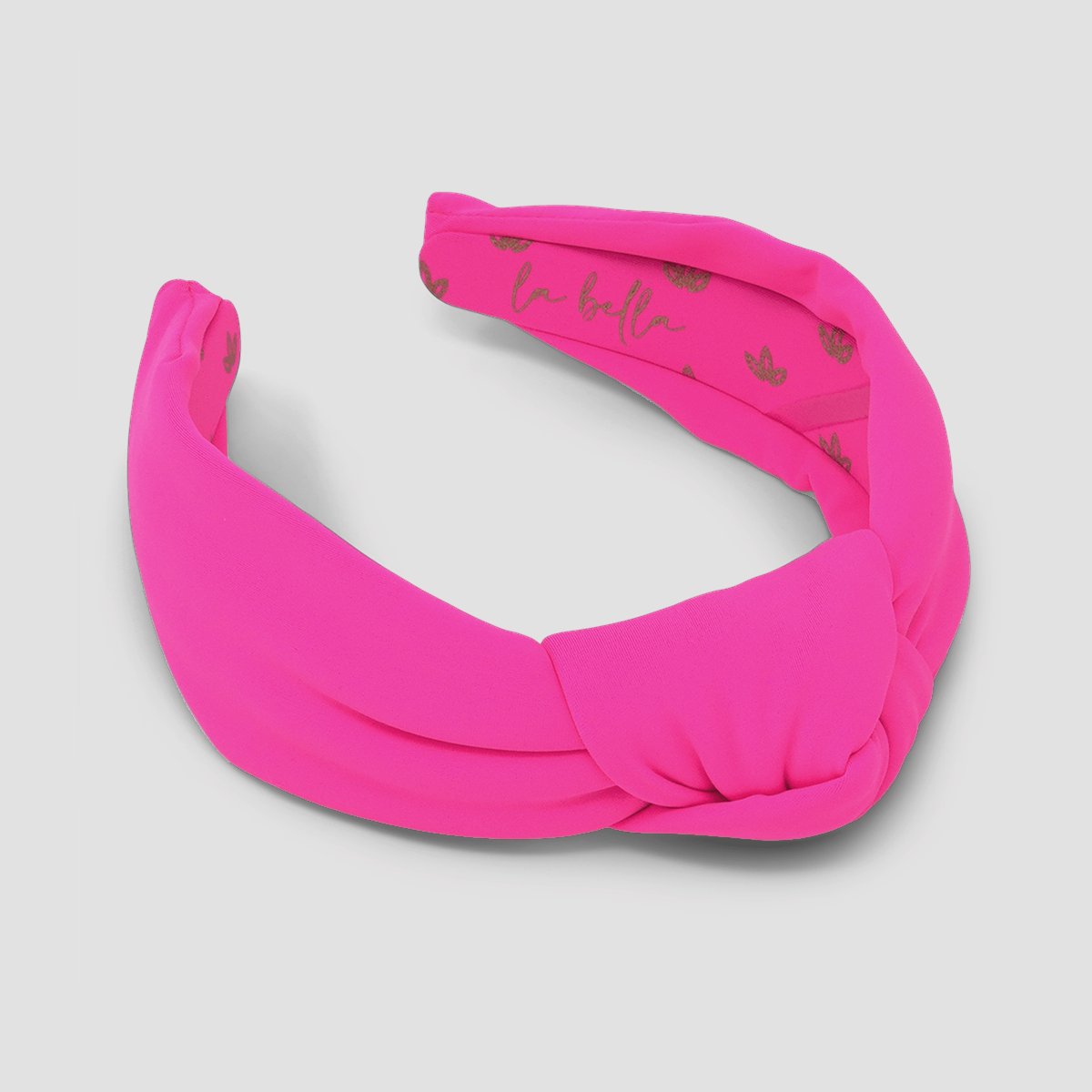 Woosh Pink Neoprene Headband by La Bella with gold flower detailing on the inside of the headband
