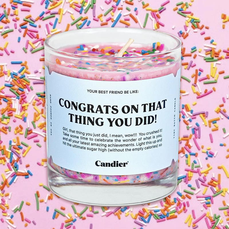 "Congrats on that thing you did!" pink Candle by Candier with sprinkle accents displayed in front of a sprinkle background