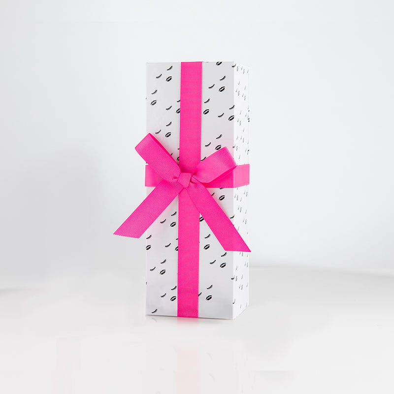 Small Gift Box with closed eyes and lips decorative pattern and topped with a pink bow