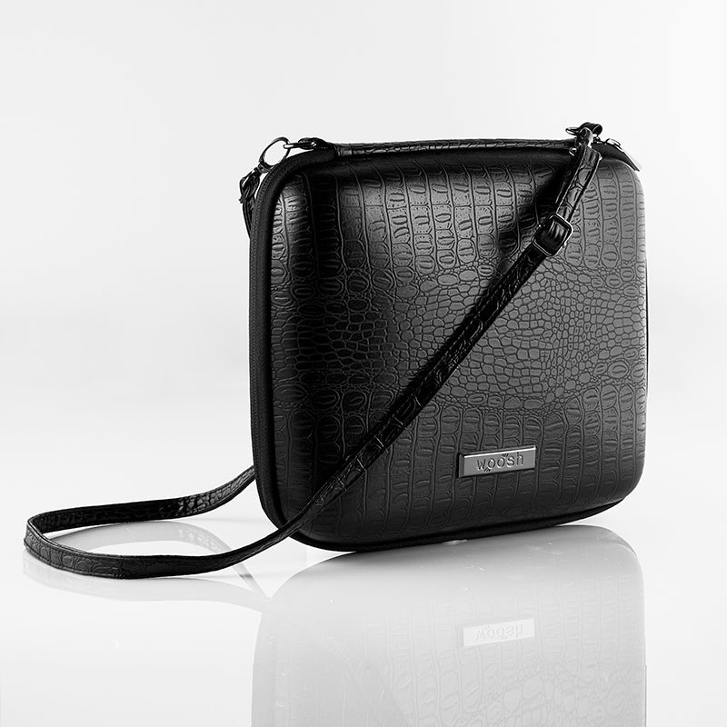 the MMS Bag closed showing shoulder strap with lizard print texture
