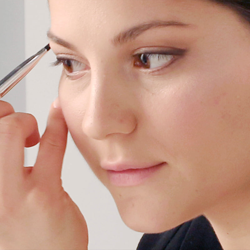 model uses essential eye brush of essential brush set with makeup brush set on eyeline