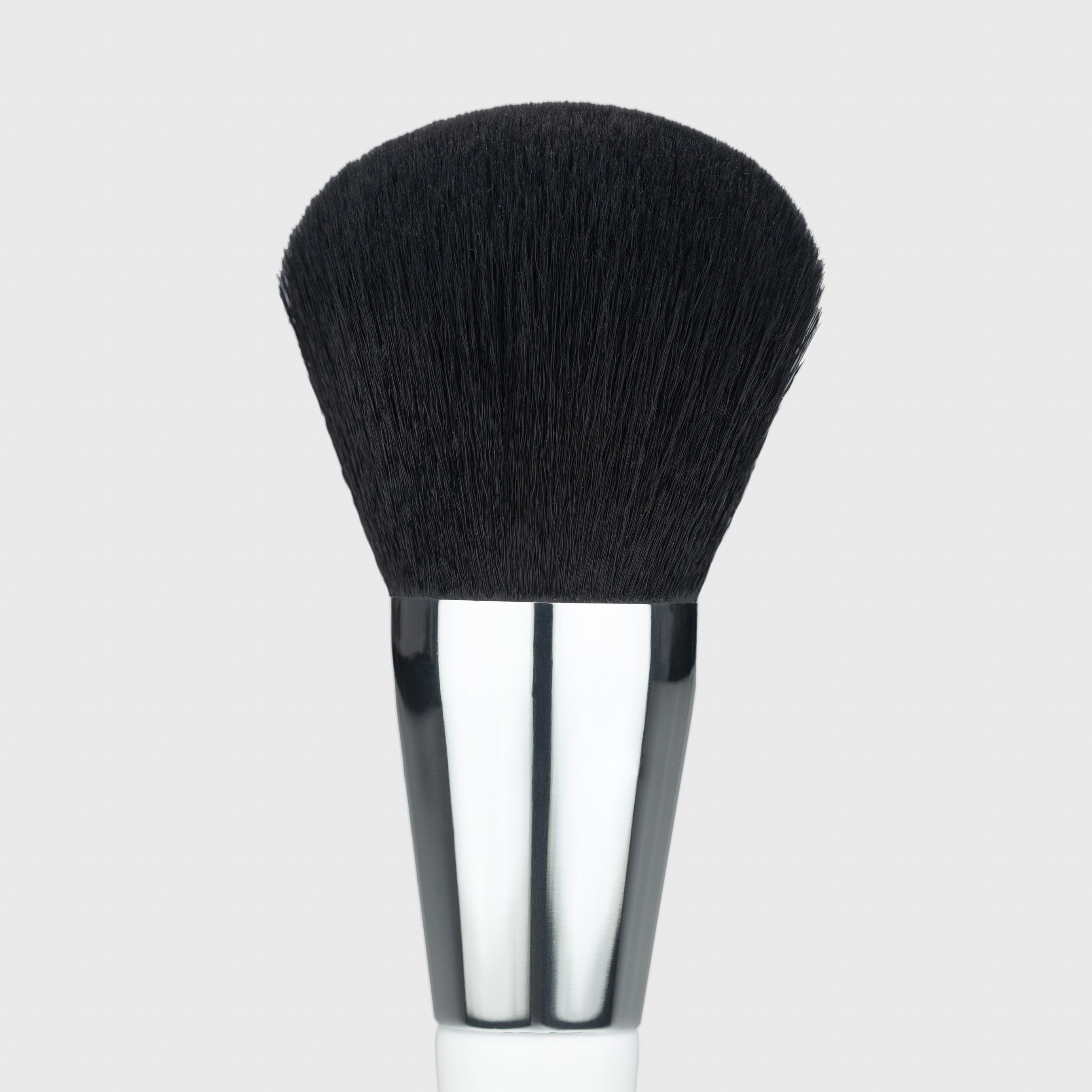 Close up of the large end of the Woosh Beauty complexion dense and fluffy brush 