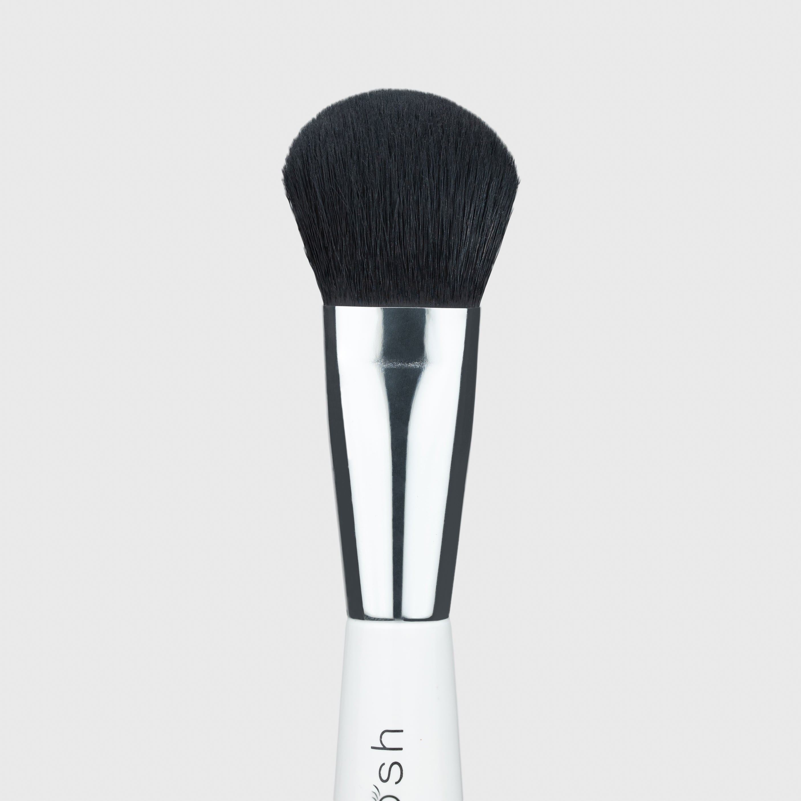 Close up of the small end of the Woosh Beauty complexion dense and fluffy brush 